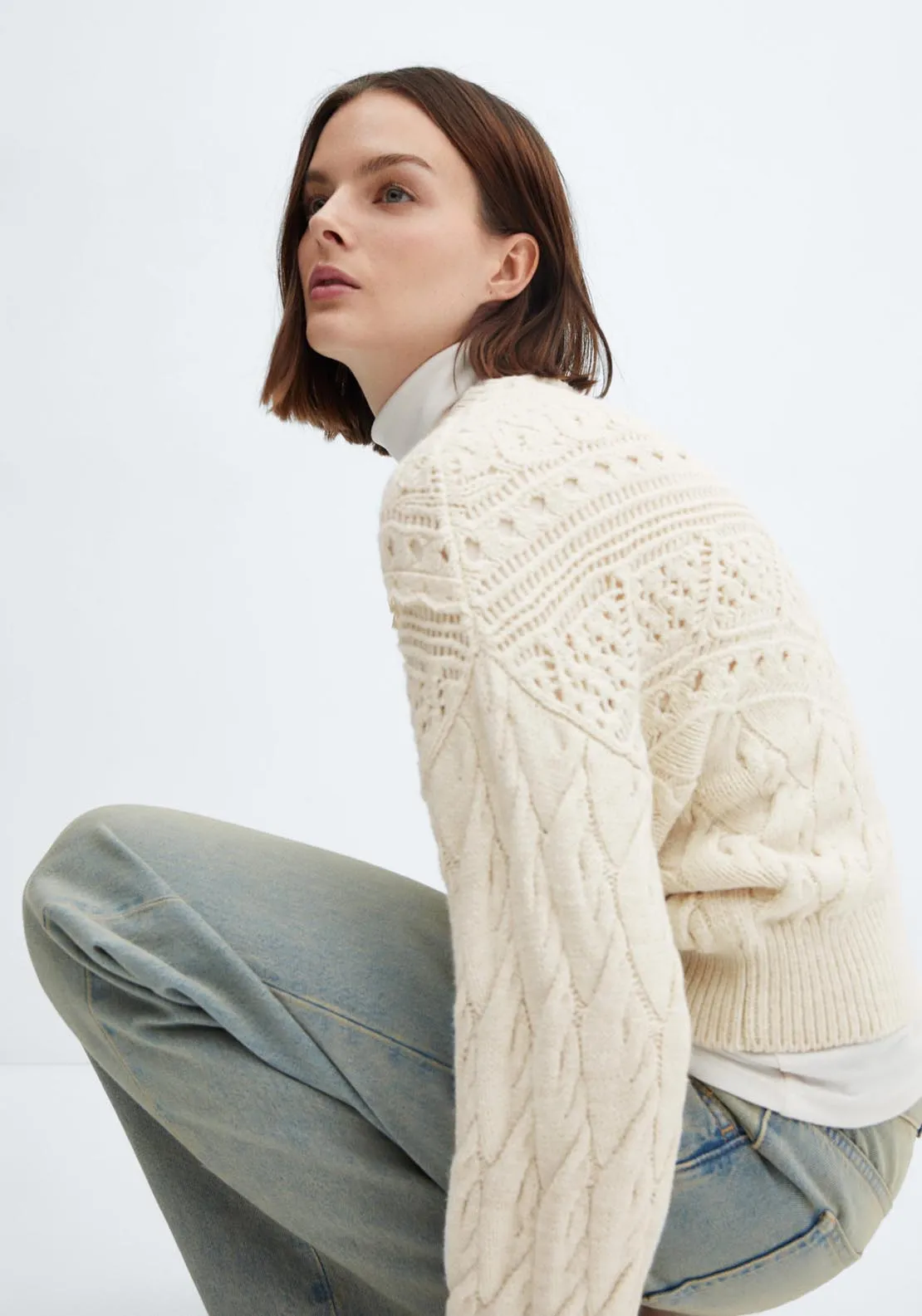 Knitted sweater with openwork details