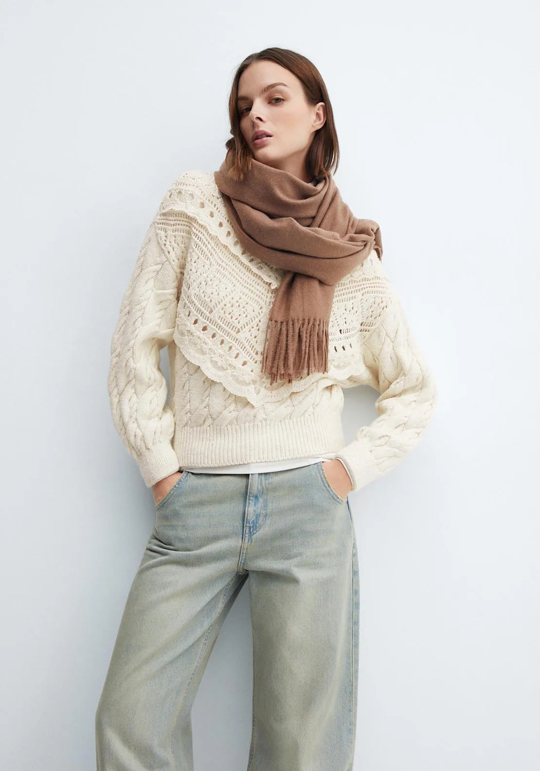 Knitted sweater with openwork details