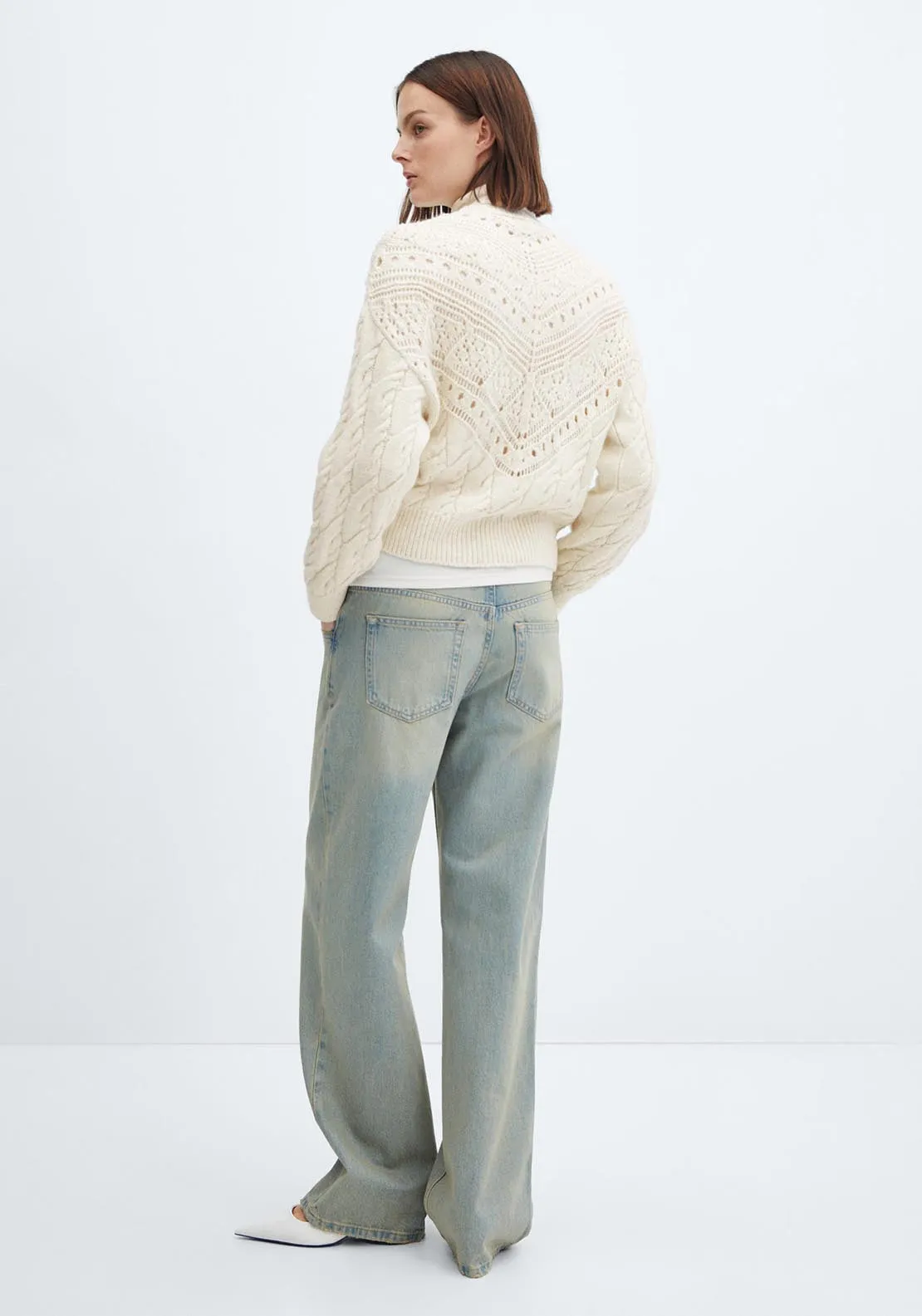 Knitted sweater with openwork details