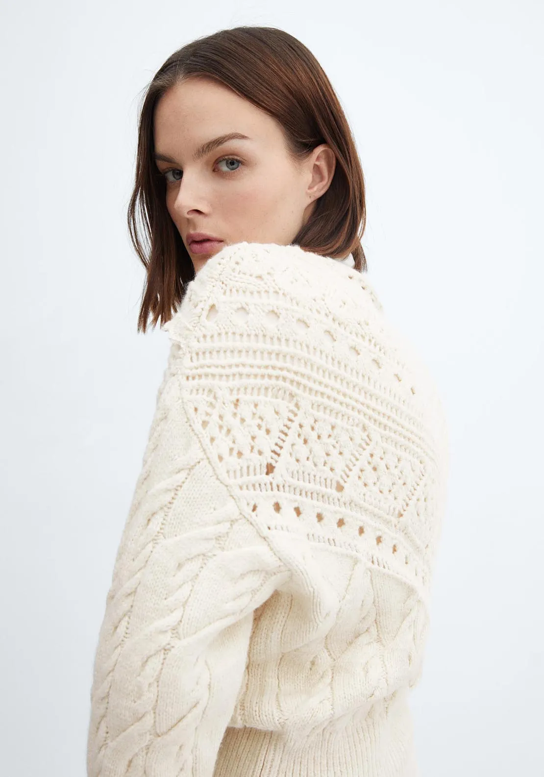 Knitted sweater with openwork details