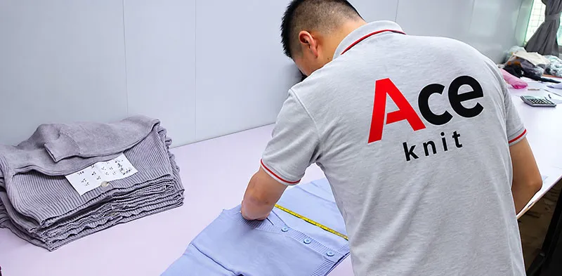 Quality inspection and measurement check on finished sweaters
