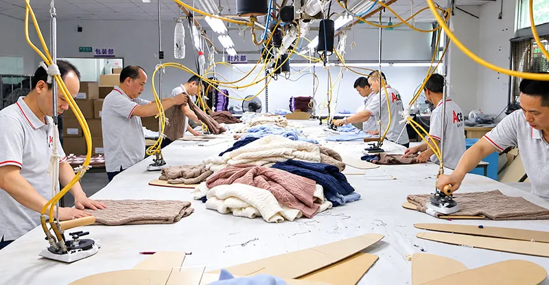 Bulk pressing and packaging of finished sweaters